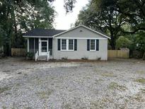 Newly renovated Ranch home with gravel driveway at 7629 Pinehurst St, North Charleston, SC 29420