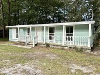 Charming light blue single-story home at 861 Savage Rd, Charleston, SC 29414