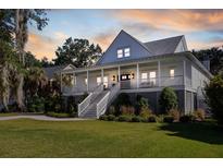 Two-story home with large front porch and landscaping at 3583 Somerset Hills Ct, Mount Pleasant, SC 29466