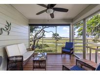 Relaxing screened porch overlooking marsh at 1712 Live Oak Park, Seabrook Island, SC 29455
