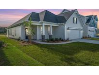 Two-story home with a front porch and attached garage; nice lawn at 126 Grange Cir, Summerville, SC 29486