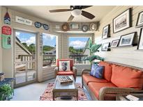 Relaxing sunroom with wicker furniture and coastal decor at 1640 Live Oak Park, Seabrook Island, SC 29455