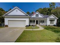 Two-story home with a white exterior, black shutters, and a porch at 1746 Pierpont Ave, Charleston, SC 29414