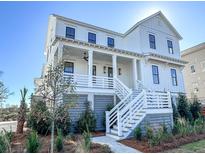Two-story home with white siding and gray accents at 1467 Jeremy Cay Ct, Awendaw, SC 29429