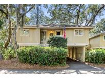 Charming raised cottage with carport and lush landscaping at 1101 Summerwind Ln, Seabrook Island, SC 29455