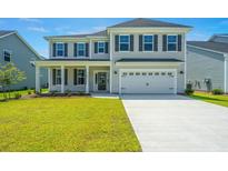 Two-story home with gray siding, black shutters, and a two-car garage at 155 Seaton Street, Summerville, SC 29486