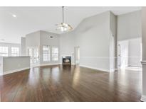 Spacious living room with hardwood floors and fireplace at 1206 Creek Stone Way, Hanahan, SC 29410