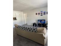 Living room with beige sofa and flat-screen TV at 2150 Spoleto Ln # B-6, North Charleston, SC 29406
