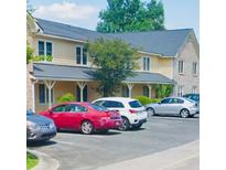 Two-story apartment building with ample parking; yellow exterior with gray roof at 2150 Spoleto Ln # B-3, North Charleston, SC 29406