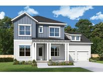 Two-story home with blue and white siding, two-car garage at 1196 Reserve Ln, Awendaw, SC 29429