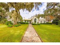 Elegant home with brick walkway and lush landscaping at 4285 Clover Hill Rd, Green Pond, SC 29446