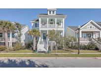 Two-story house with front porch and palm trees at 2600 Josiah St, Charleston, SC 29492
