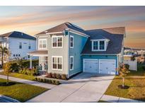 Two-story house with light teal siding, gray roof, and two-car garage at 404 Cool Bend Ln, Summerville, SC 29486