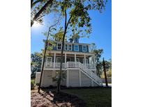 Two story home with light blue siding and white trim at 1208 Stone Post Rd, Charleston, SC 29412