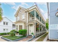 Two story home with wrap around porch and side yard at 175 Wentworth St # A, Charleston, SC 29401