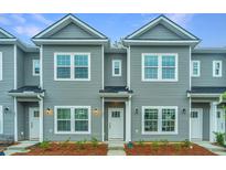 Two-story townhouses with gray siding and white trim at 1103 Twin Rivers Drive # 71, Wando, SC 29492