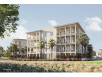 Three-story building with balconies, palm trees, and manicured landscaping at 325 Longshore St # 1123, Daniel Island, SC 29492