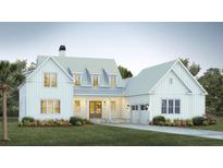 Two-story farmhouse with metal roof and landscaping at 4029 Kaolin St # 6, Charleston, SC 29407