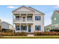 Two story home with blue shutters and front porch at 218 Symphony Ave, Summerville, SC 29486