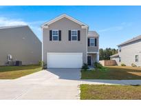 Two-story home with a two-car garage and well-maintained landscaping at 728 Ladywood Dr, Summerville, SC 29486