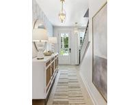 Bright and airy entryway with stylish console table at 297 Claret Cup Way, Charleston, SC 29414