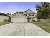 Two-story house with a two-car garage and driveway at 174 Education Blvd, Ladson, SC 29456