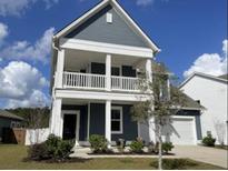 Two story house with front porch and landscaping at 513 W Respite Ln, Summerville, SC 29483