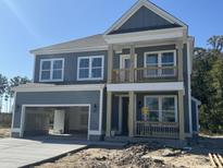 Two-story gray house with white accents and a balcony at 357 Wappoo Trace Ln, Summerville, SC 29486