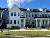 Two-story townhouses with gray and white siding, front porches, and landscaping at 768 Blueway Ave, Summerville, SC 29486