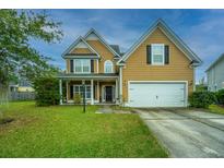 Two-story house with a large front yard and driveway at 3807 Canary Ct, North Charleston, SC 29420