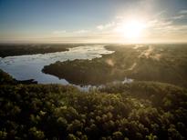 Aerial view of a serene landscape at sunrise, featuring a tranquil river at 3877 Summerton St, Mount Pleasant, SC 29466