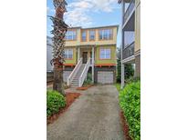 Two-story home with two-car garage and attractive exterior at 204 Michigan Ave # D2, Folly Beach, SC 29439