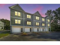Townhouses with attached garages at dusk at 211 Cache Ct # 6, Charleston, SC 29414