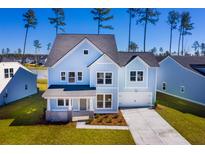 Stunning two-story light blue house with a gray roof at 172 Belfort Pl, Summerville, SC 29486