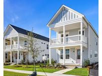 Two story light gray houses with pink door and balcony at 341 Trailmore Ln, Summerville, SC 29486