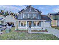 Two-story home with a front porch and landscaped yard at 176 Belfort Pl, Summerville, SC 29486