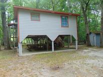 Elevated home with covered picnic area underneath at 3791 Cannon Rd, Round O, SC 29474