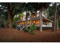 Charming one-story home nestled in a lush, wooded setting at 2588 High Hammock Rd, Johns Island, SC 29455