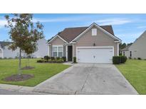 One story home with attached garage and manicured lawn at 126 Harbor Trace Ln, Summerville, SC 29486