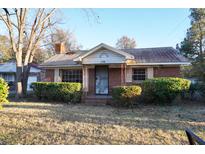 Brick ranch house with mature landscaping at 150 M L King Blvd, Saint Stephen, SC 29479