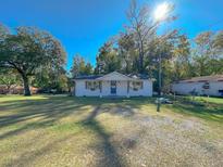 Newly renovated home with white exterior and landscaping at 6805 Sc-162, Hollywood, SC 29449