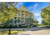 Luxury condo building with lush landscaping at 4252 Faber Dr # 203, North Charleston, SC 29405