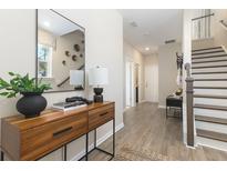 Bright and airy entryway with stylish console table and mirror at 819 Recess Pointe Dr # 46, Moncks Corner, SC 29461