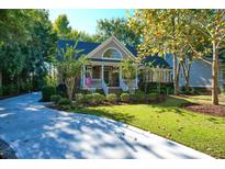 Brick home with a front porch and landscaped yard at 3400 Henrietta Hartford Rd, Mount Pleasant, SC 29466