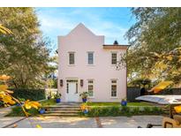 Pink two-story house with landscaped yard and brick driveway at 429 Venning St, Mount Pleasant, SC 29464