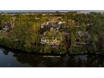 Luxury home nestled in a serene wooded setting with a pool and private dock at 415 Estuary Ln, Kiawah Island, SC 29455