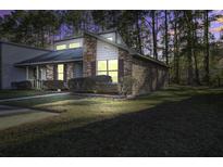 Brick house with well-manicured lawn at dusk at 415 Miami St # B, Ladson, SC 29456