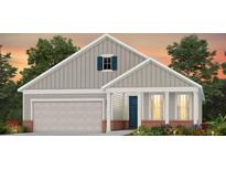 Two-story house with gray siding, a two-car garage, and a charming front porch at 642 Coral Bells Ln, Summerville, SC 29486