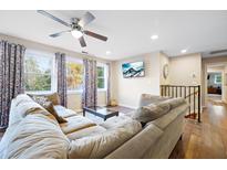 Spacious living room featuring comfortable sofas and large windows at 109 Beacon Ave, Moncks Corner, SC 29461
