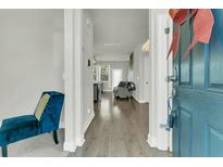 Bright and airy entryway with hardwood floors, leading to living room at 7833 Montview Rd, North Charleston, SC 29418